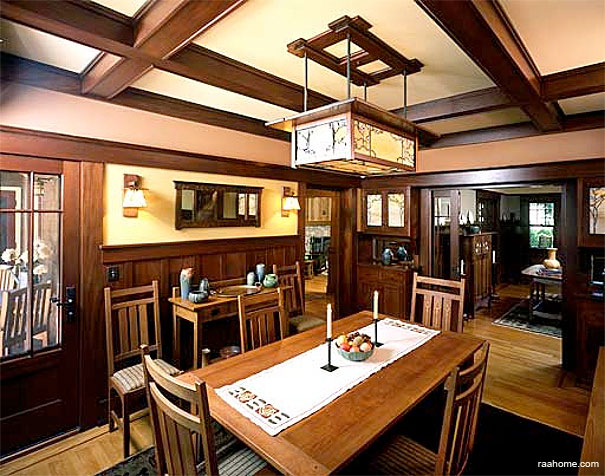 Craftsman interior with typical dark stained woodwork, board and batten wainscoting, mission-style furnishings, and art glass lights.