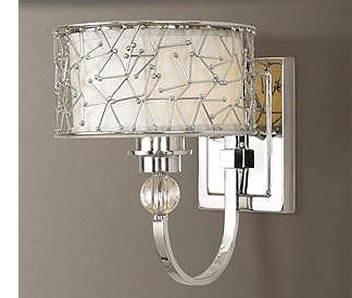 Use sconces on both sides of a bathroom mirror instead of overhead lights.