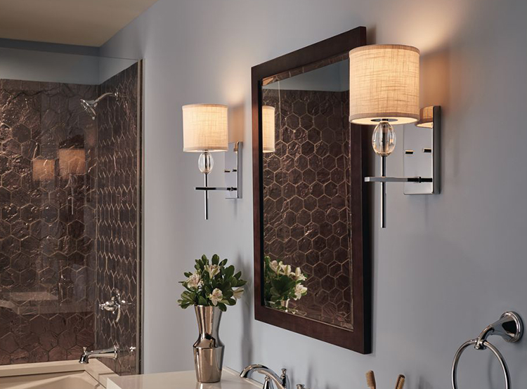 Sconces on each side of the mirror are functional and enhance a room’s look.