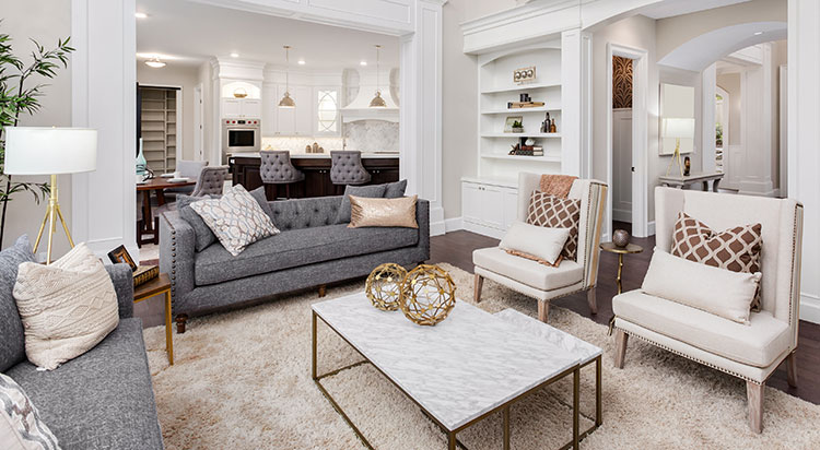 A roomy coffee table placed between chairs and sofas help create areas that invite conversation.